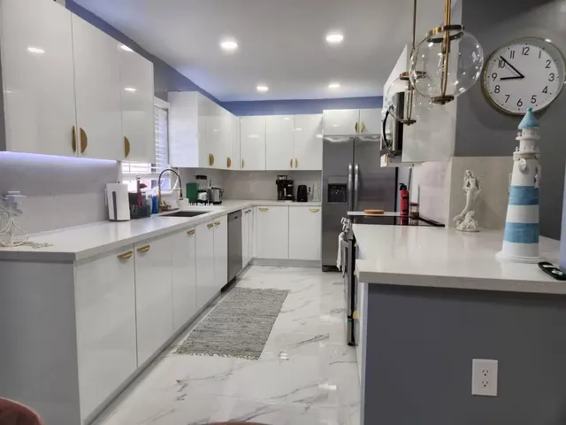 a kitchen with cabinets and window