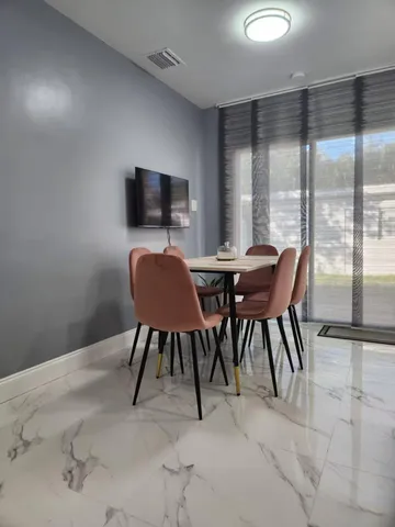 a view of a dining room with furniture