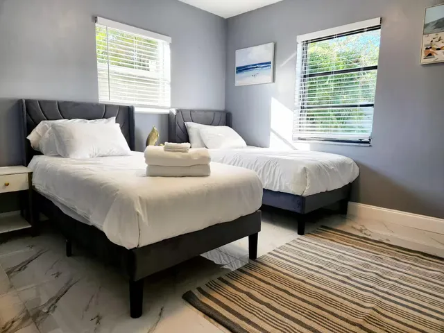 a bedroom with bed and a window