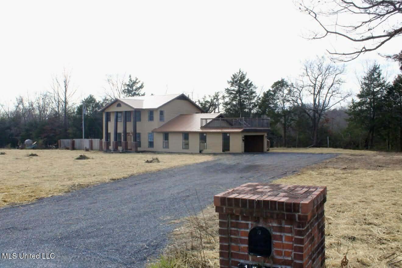 1838 Dees Road Batesville, MS 38606 - Photo 2 of 27 front side angle of house