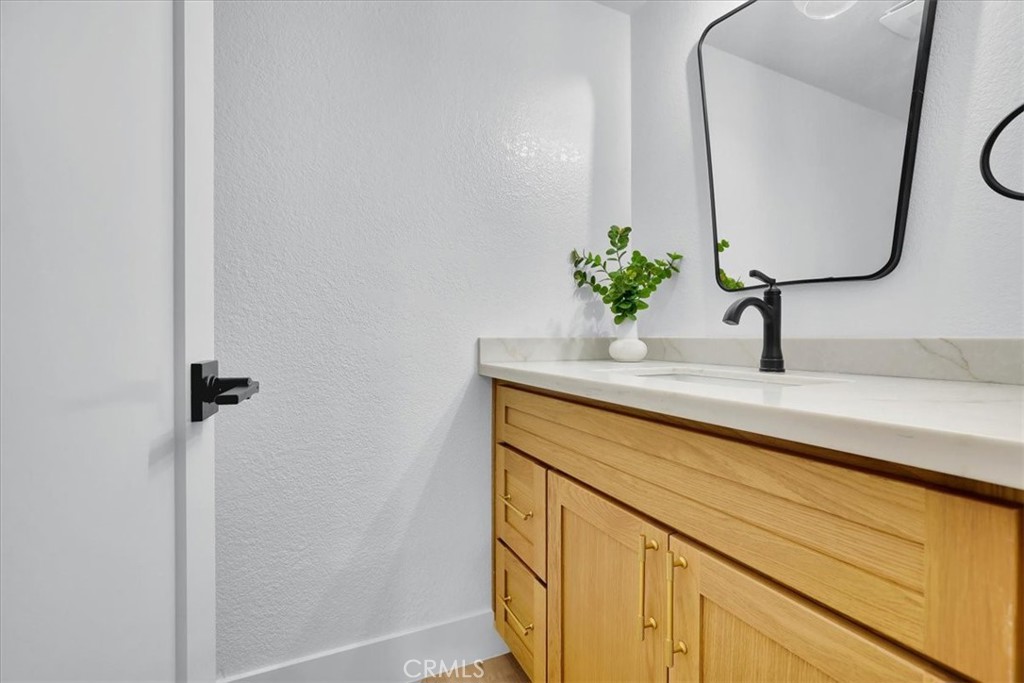 21029 Stoddard Wells Road Walnut, CA 91789 - Photo 17 of 34 a bathroom with a sink and a mirror