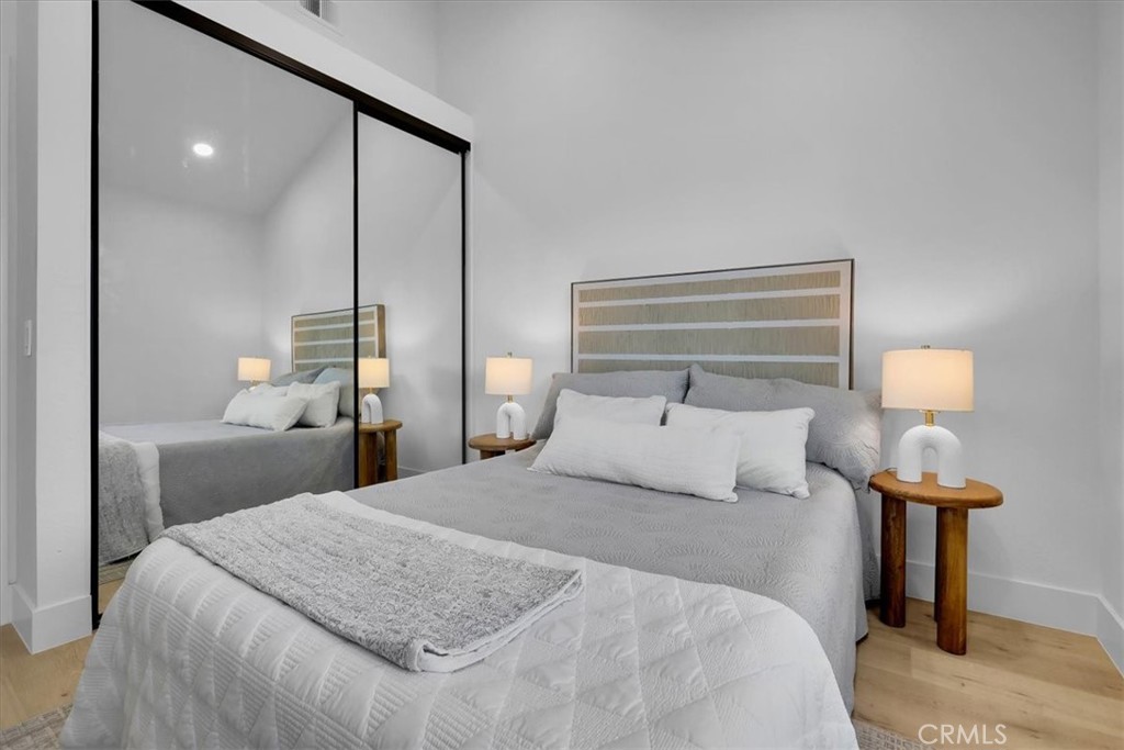 21029 Stoddard Wells Road Walnut, CA 91789 - Photo 19 of 34 a bedroom with a bed and a lamp