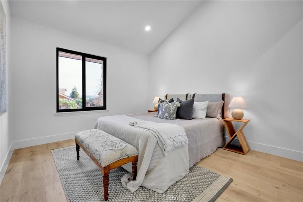 21029 Stoddard Wells Road Walnut, CA 91789 - Photo 20 of 34 a bedroom with a bed and wooden floor
