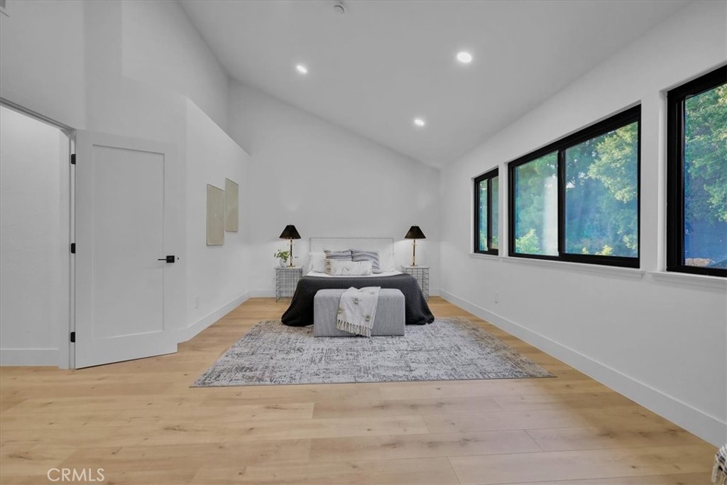 21029 Stoddard Wells Road Walnut, CA 91789 - Photo 25 of 34 a bedroom with a large bed and a large window
