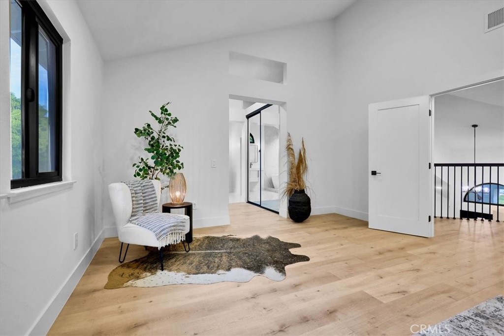 21029 Stoddard Wells Road Walnut, CA 91789 - Photo 27 of 34 a living room with furniture and a potted plant