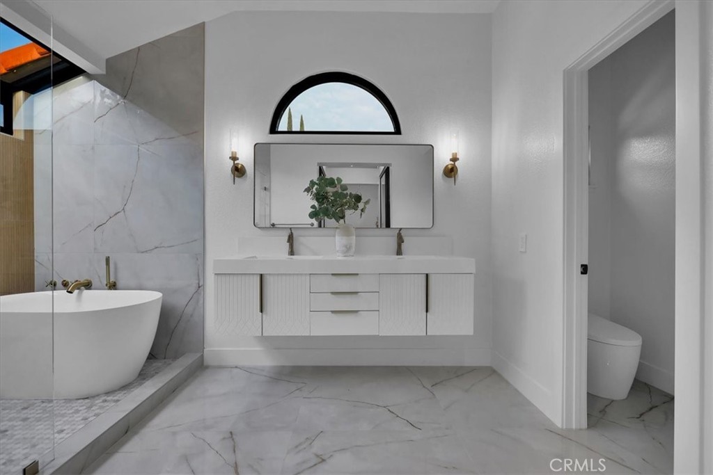 21029 Stoddard Wells Road Walnut, CA 91789 - Photo 28 of 34 a bathroom with a sink and a mirror