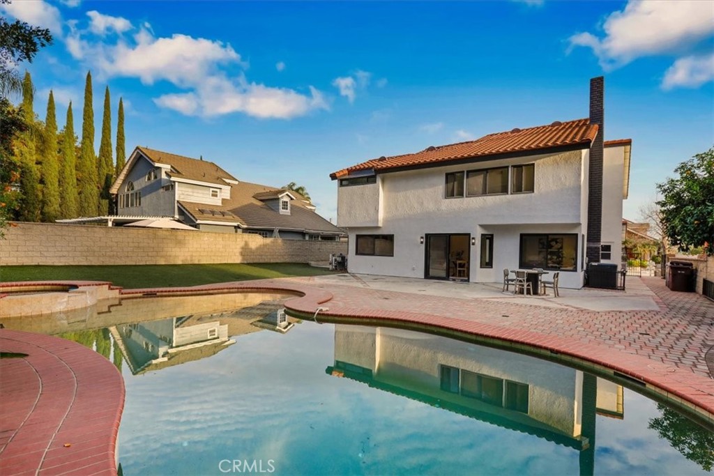 21029 Stoddard Wells Road Walnut, CA 91789 - Photo 31 of 34 a view of a house with pool and chairs