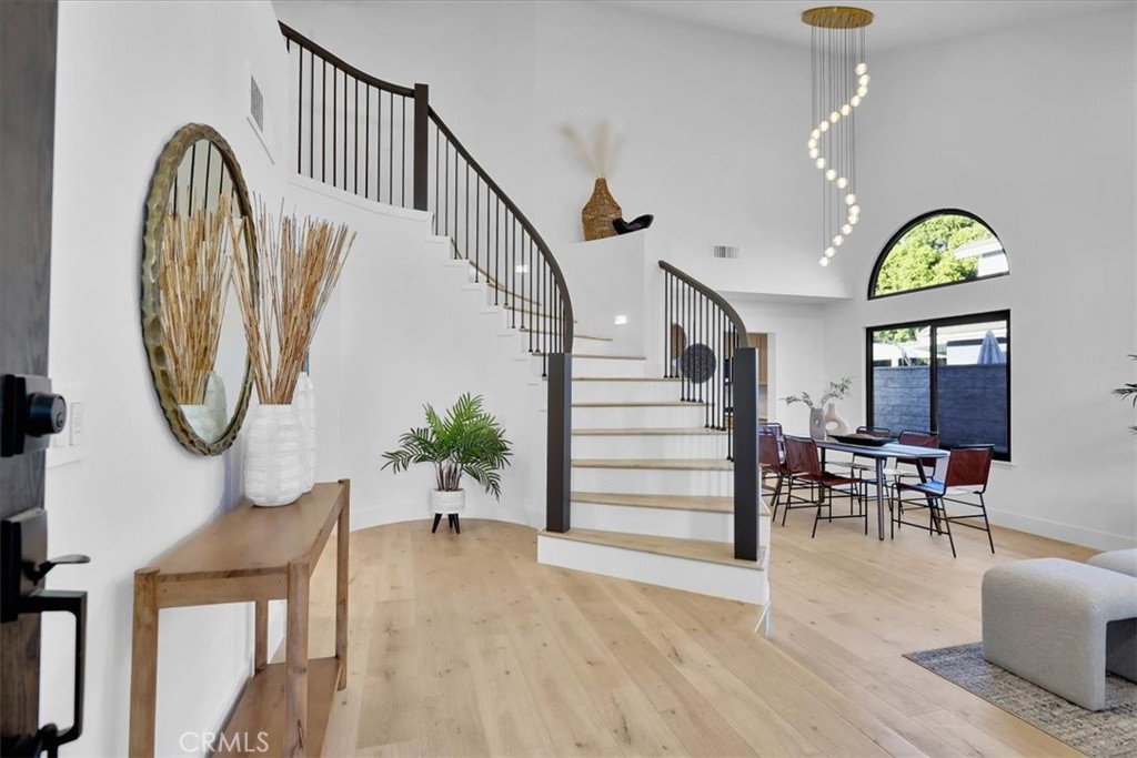 21029 Stoddard Wells Road Walnut, CA 91789 - Photo 4 of 34 a view of a livingroom with furniture staircase entryway and wooden floor