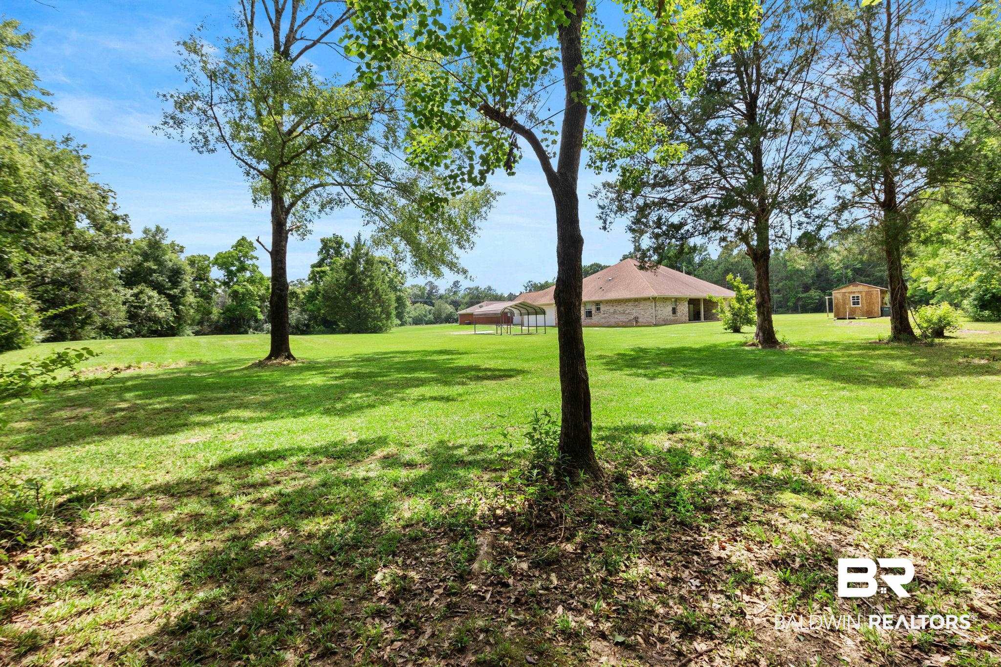 16151 Tolbert Road Bay Minette, AL 36507 - Photo 60 of 74 Expansive green lawn with mature trees