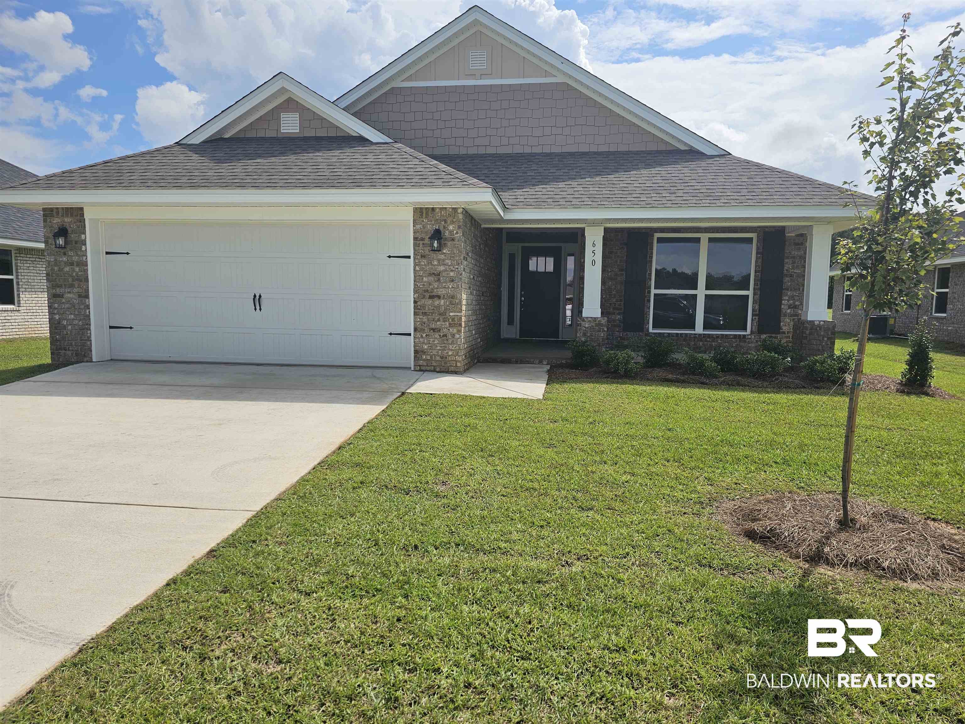 650 Revere Street Foley, AL 36535 - Photo 1 of 34 Craftsman house with a garage and a front lawn