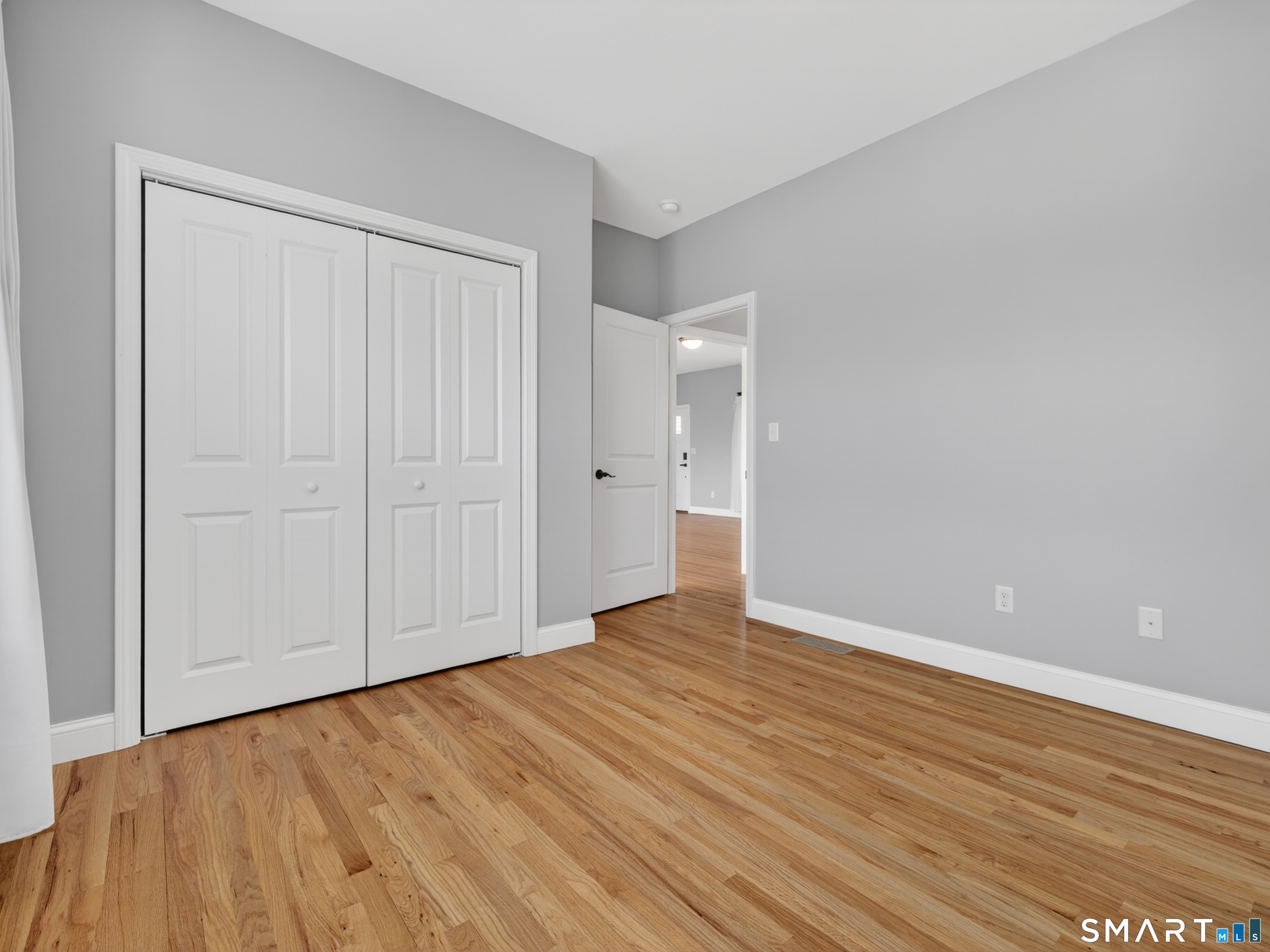 650 Ridgewood Road Middletown, CT 06457 - Photo 25 of 40 a view of an empty room with wooden floor