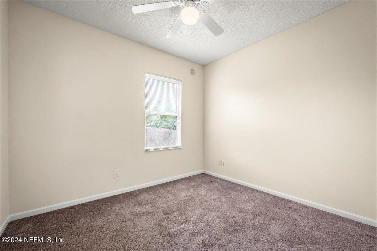 1953 Benedict Road Jacksonville, FL 32209 - Photo 13 of 23 an empty room with a window
