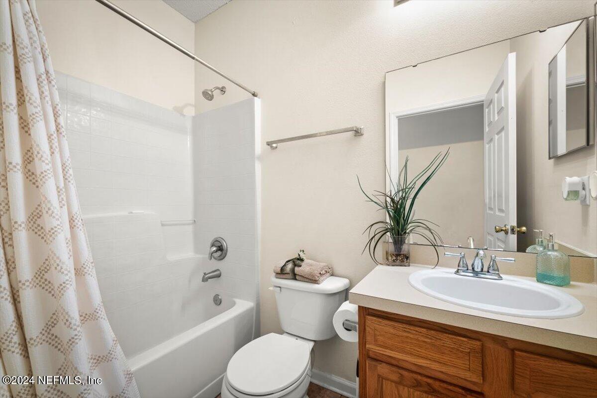 1953 Benedict Road Jacksonville, FL 32209 - Photo 15 of 23 a bathroom with a sink toilet and shower