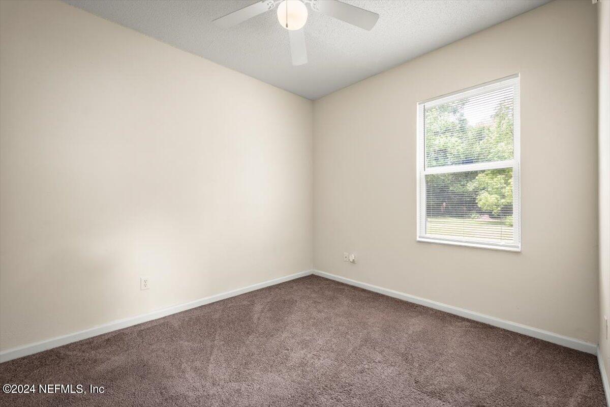 1953 Benedict Road Jacksonville, FL 32209 - Photo 16 of 23 an empty room with a window