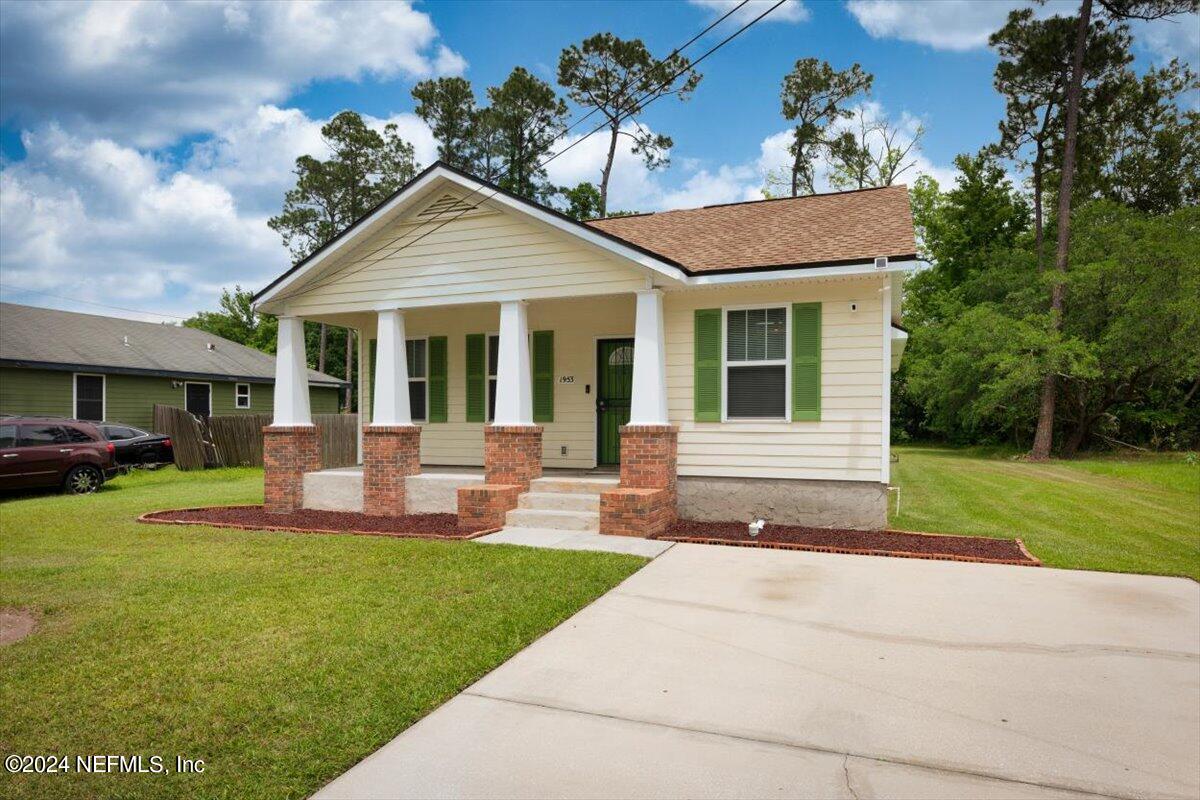 1953 Benedict Road Jacksonville, FL 32209 - Photo 2 of 23 a front view of a house with a yard