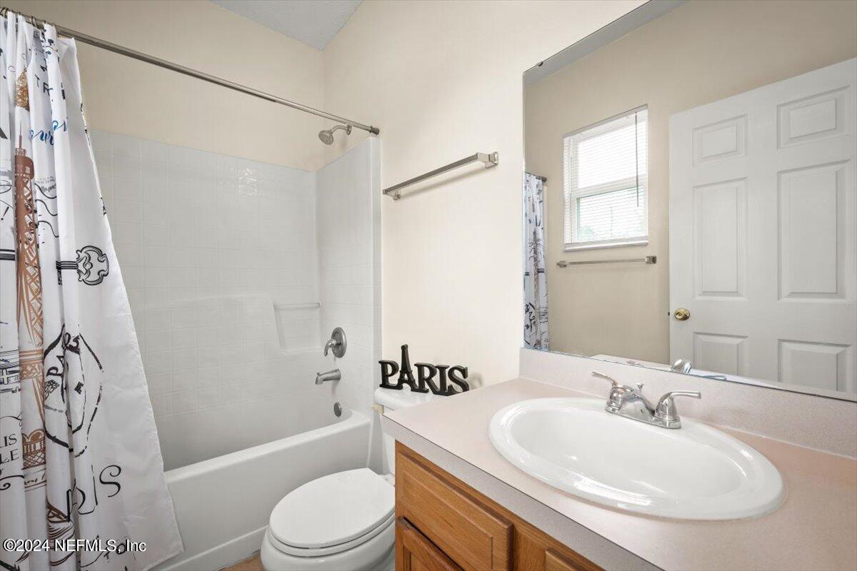 1953 Benedict Road Jacksonville, FL 32209 - Photo 21 of 23 a bathroom with a sink toilet and shower