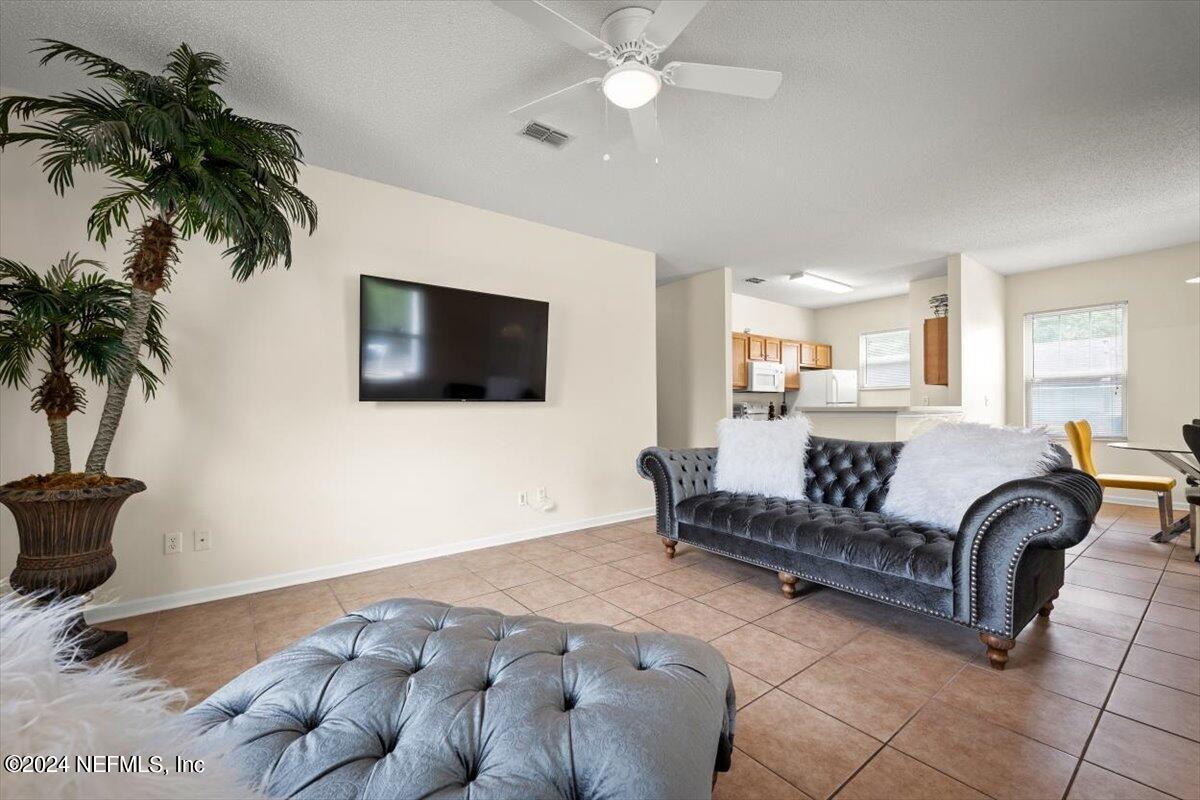 1953 Benedict Road Jacksonville, FL 32209 - Photo 3 of 23 a living room with furniture and a flat screen tv
