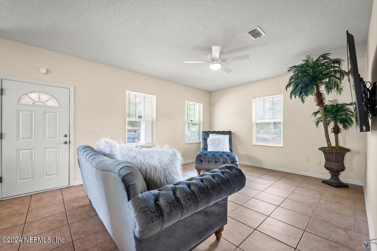 1953 Benedict Road Jacksonville, FL 32209 - Photo 5 of 23 a living room with furniture and a potted plant