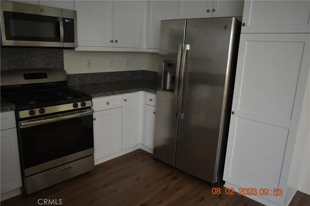 a view of a pathway both side of grassy field with stairs