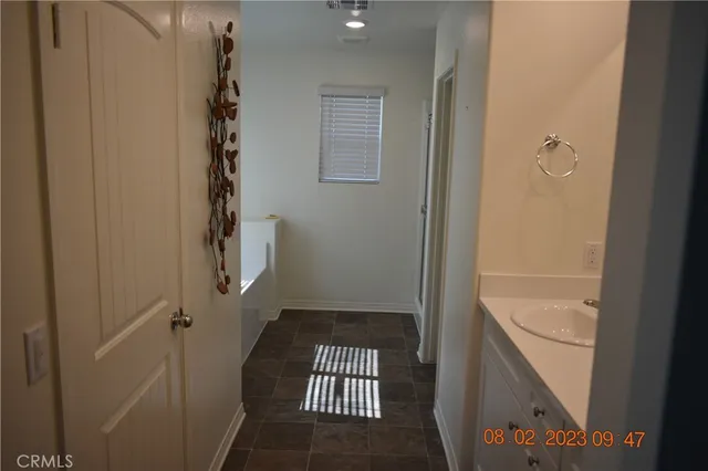 a bathroom with a shower and a sink