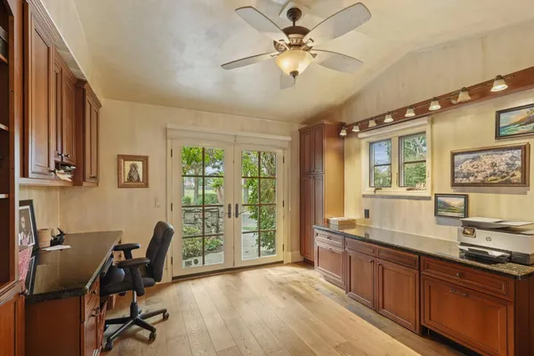 a bathroom with a granite countertop sink mirror and toilet