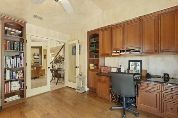 a view of a hallway view with wooden floor and staircase
