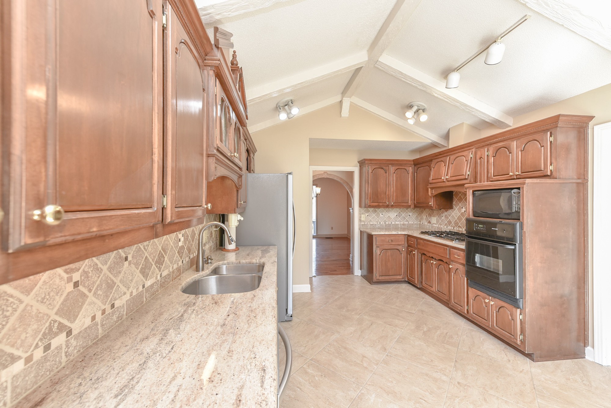 450 Bell Road Gallatin, TN 37066 - Photo 12 of 45 a kitchen with stainless steel appliances granite countertop a sink and cabinets