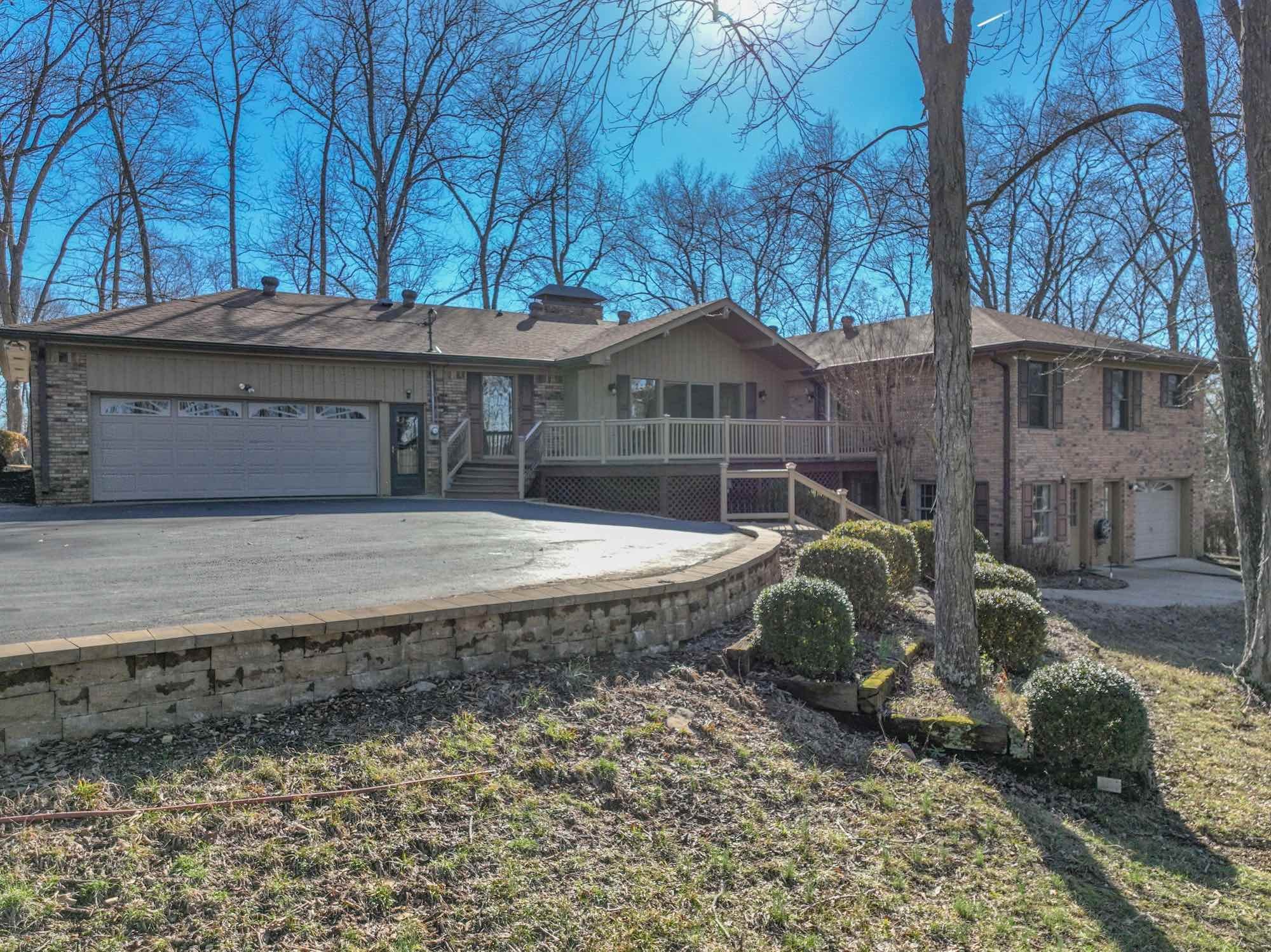 450 Bell Road Gallatin, TN 37066 - Photo 2 of 45 a large tree in front of a house