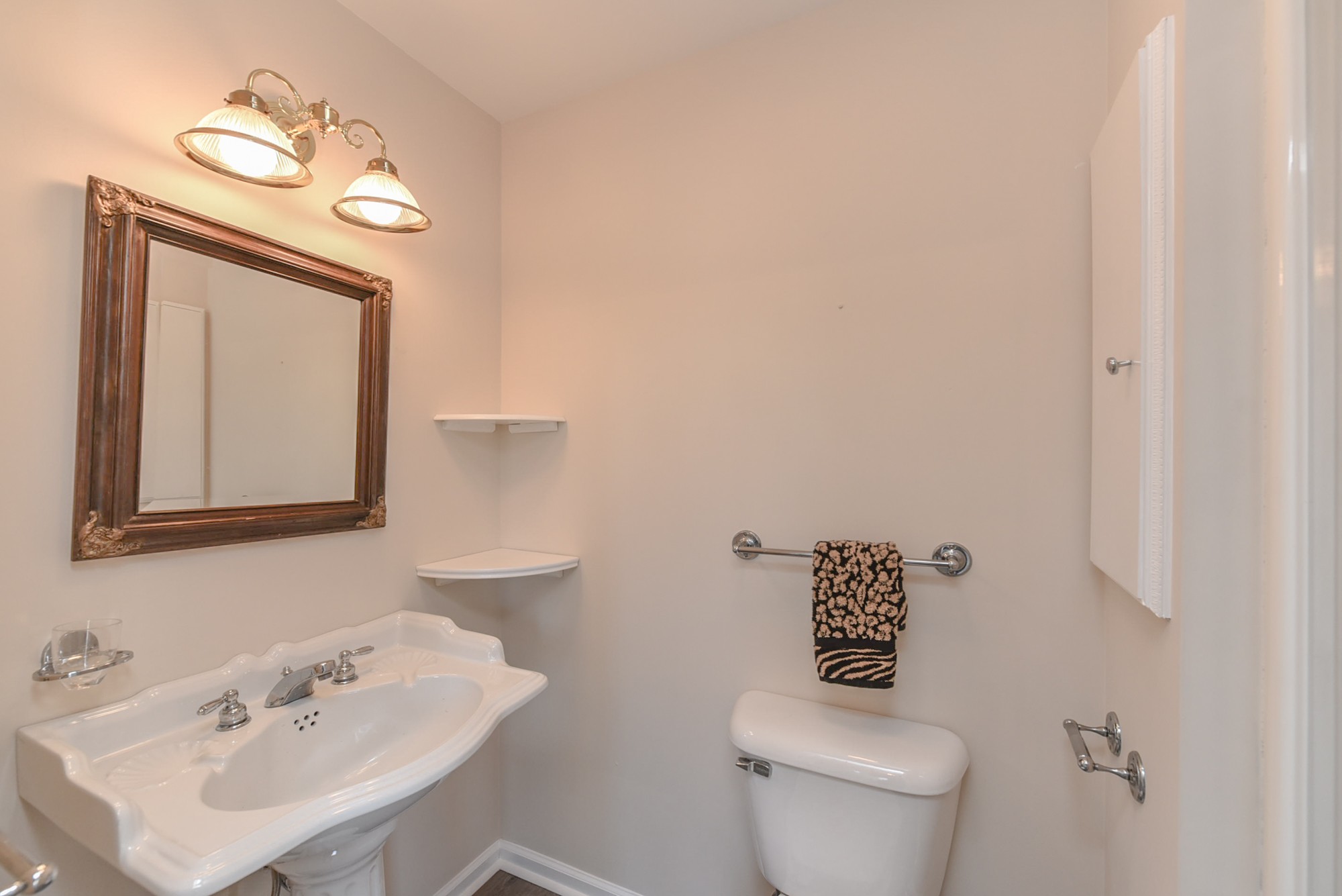 450 Bell Road Gallatin, TN 37066 - Photo 32 of 45 a bathroom with a toilet a sink and mirror