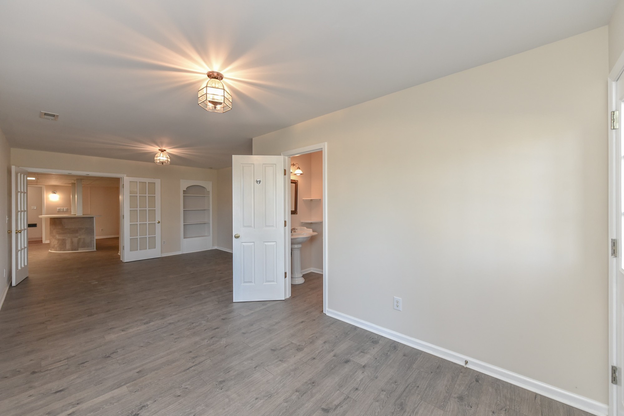 450 Bell Road Gallatin, TN 37066 - Photo 33 of 45 a view of an empty room with wooden floor and a ceiling fan