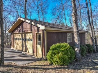 450 Bell Road Gallatin, TN 37066 - Photo 36 of 45 a view of a house with a small yard and plants