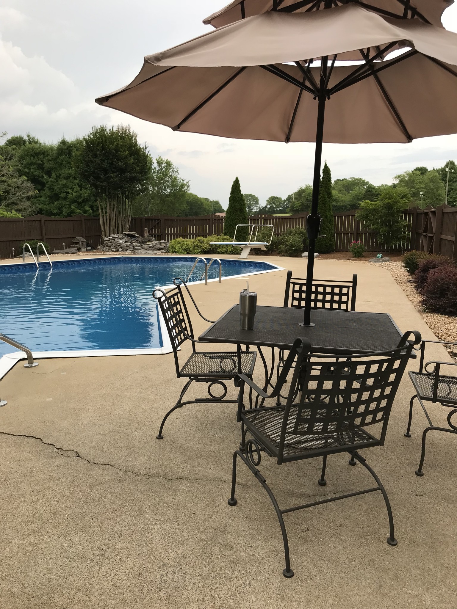 450 Bell Road Gallatin, TN 37066 - Photo 45 of 45 a view of an outdoor sitting area with furniture and a umbrella