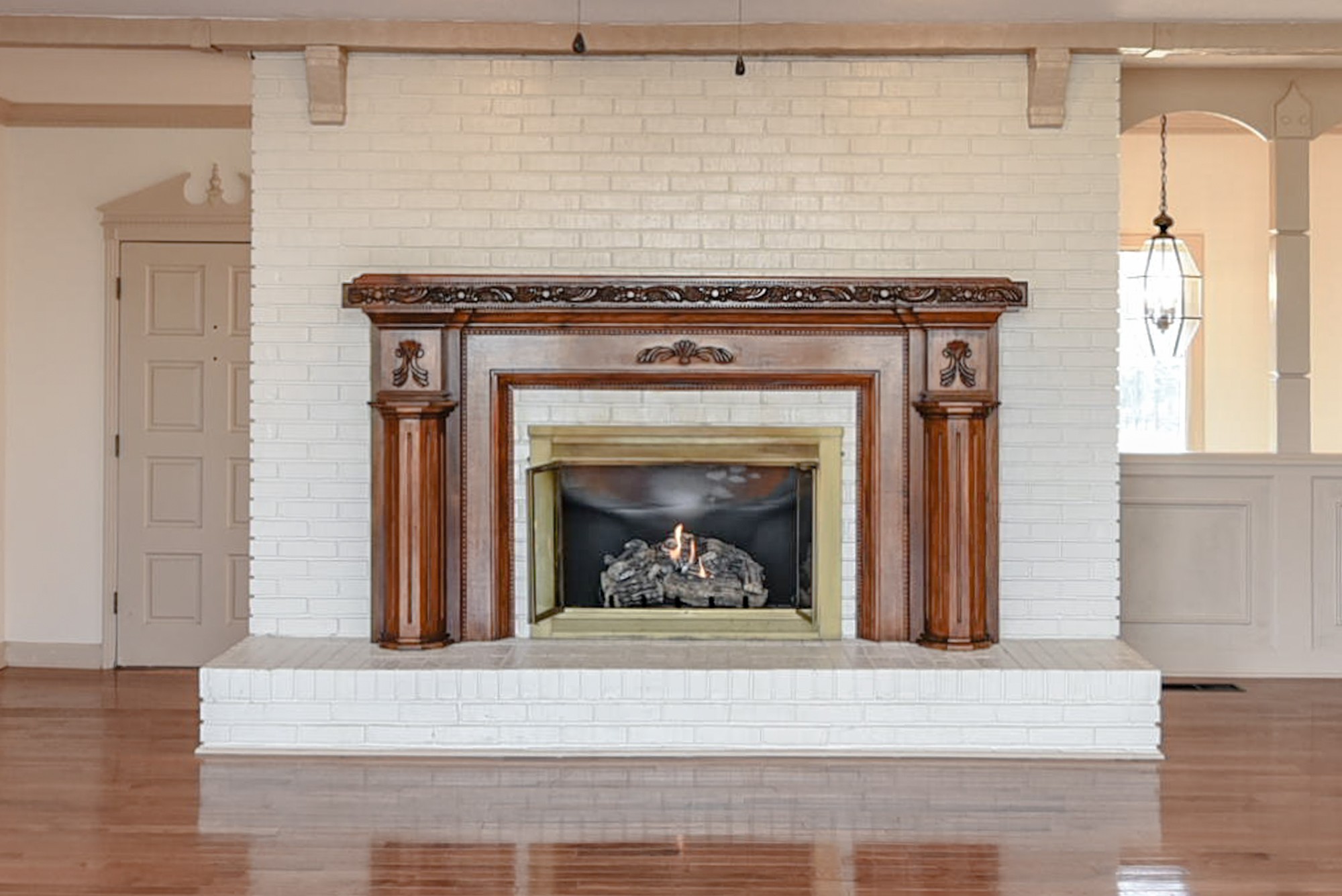 450 Bell Road Gallatin, TN 37066 - Photo 7 of 45 a living room with a fireplace and wooden floor