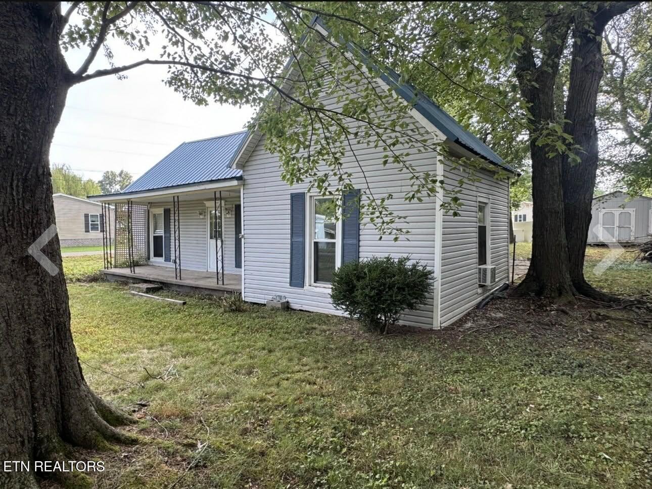 1200 North Church Street Portland, TN 37148 - Photo 14 of 17 front view of a house with a yard