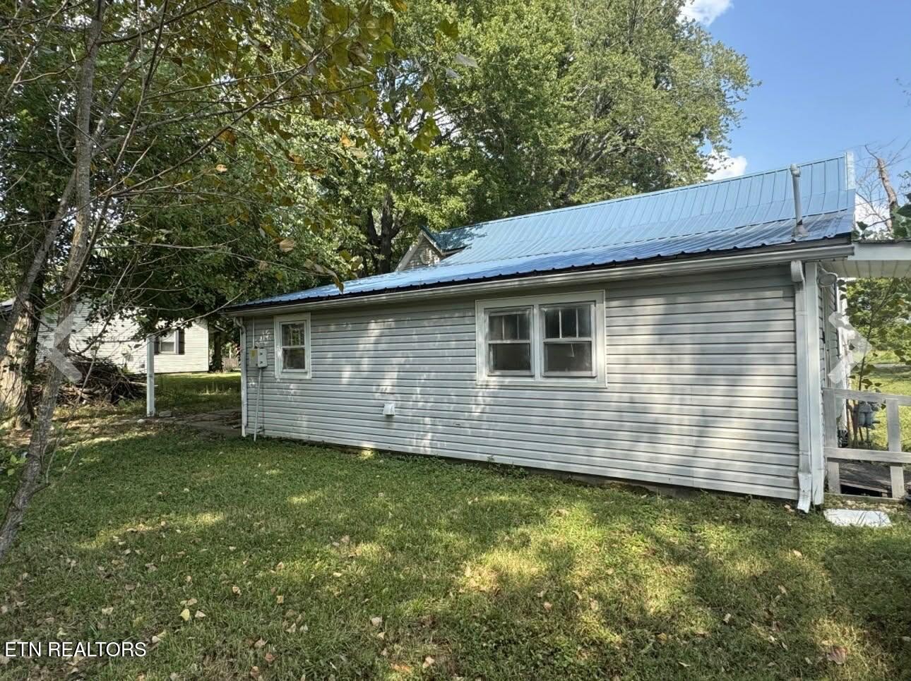 1200 North Church Street Portland, TN 37148 - Photo 16 of 17 a view of a backyard