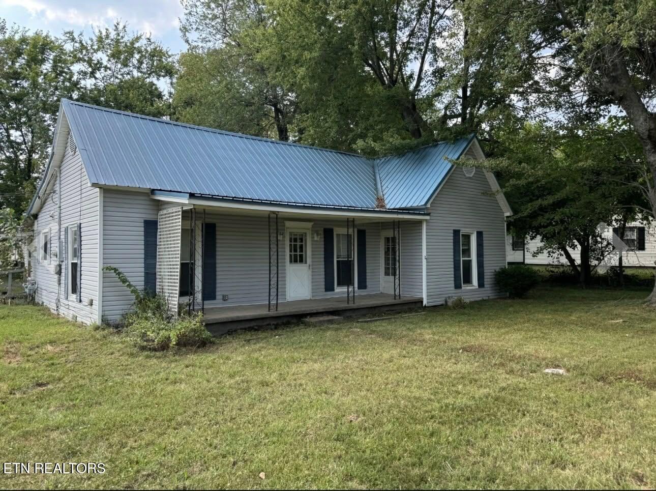 1200 North Church Street Portland, TN 37148 - Photo 3 of 17 a view of a house with a garden