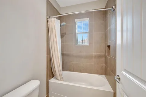 a room with a table and potted plant