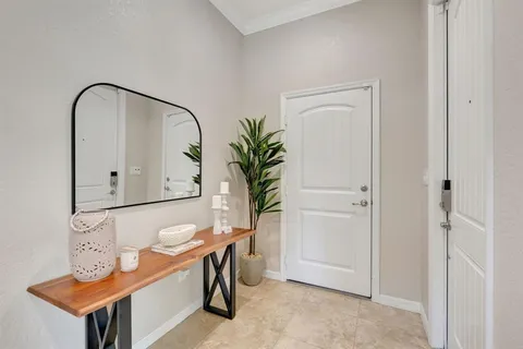 a view of a house with backyard swimming pool and sitting area