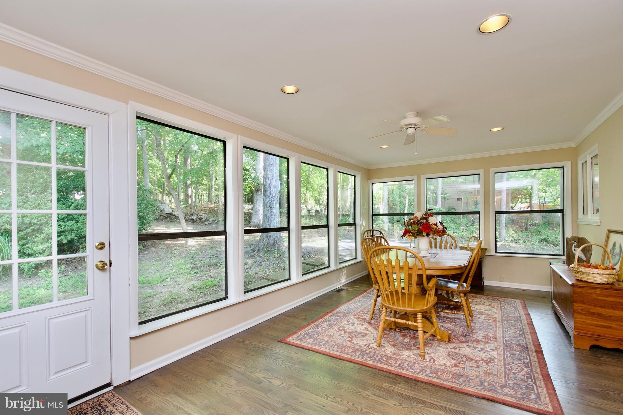 703 Gold Valley Road Locust Grove, VA 22508 - Photo 6 of 10 a dining room with table chairs and wooden floor