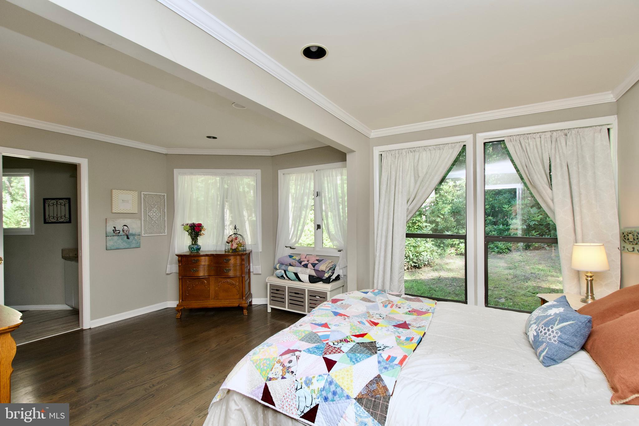 703 Gold Valley Road Locust Grove, VA 22508 - Photo 8 of 10 a bedroom with a bed and wooden floor