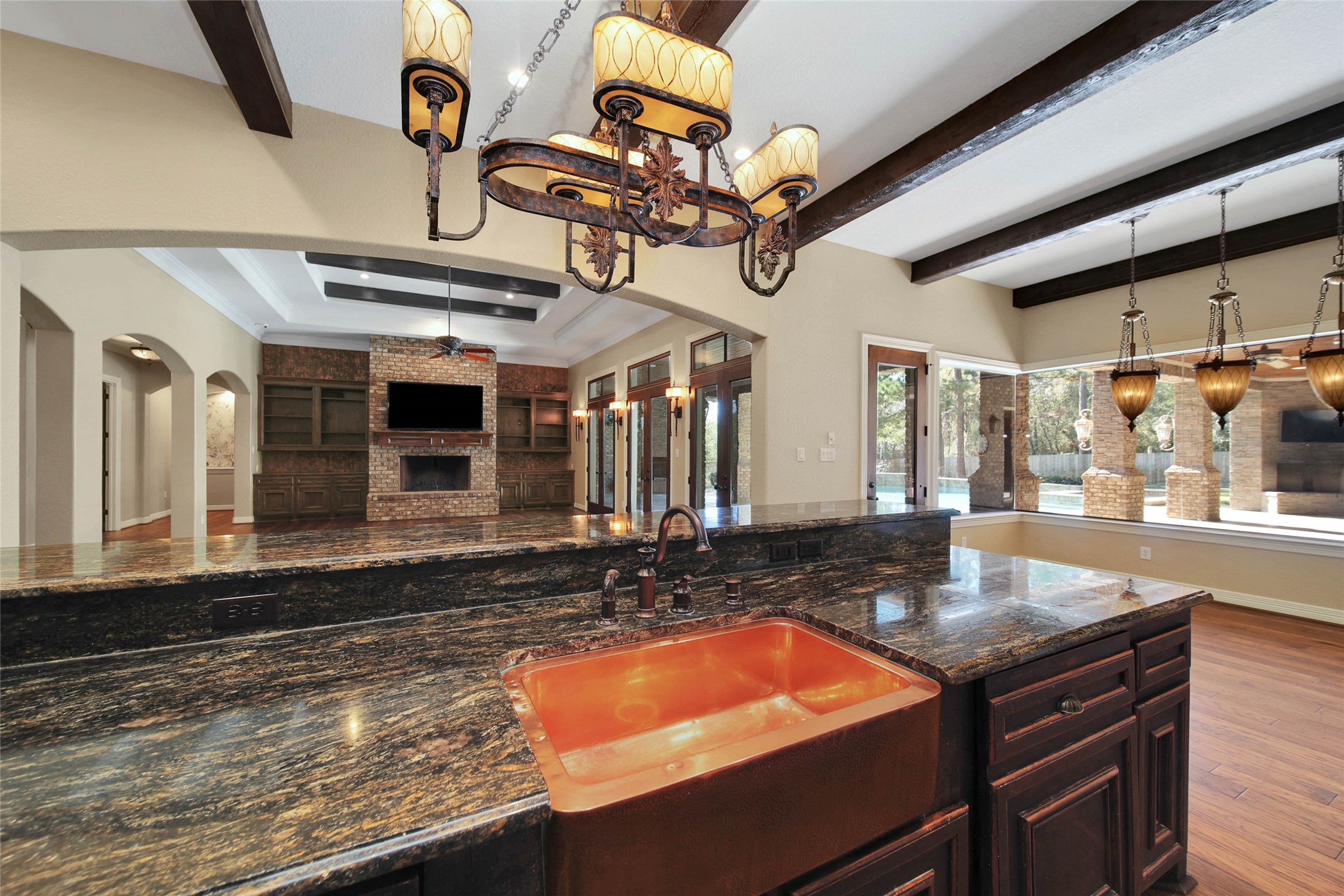 6803 Star Ledge Court Spring, TX 77389 - Photo 14 of 48 Stunning farmhouse copper sink in this fabulous kitchen - open to Family Room, Breakfast Room, and offering views of the outdoor living space and pool