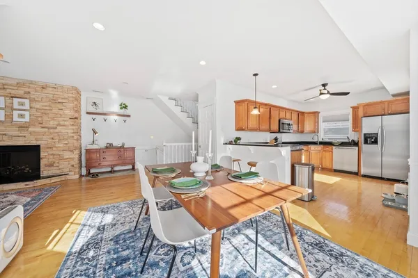 a living room with furniture and kitchen view