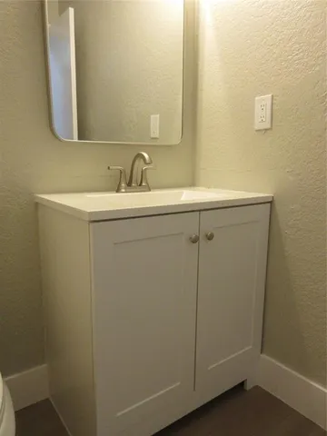 a bathroom with a sink and mirror