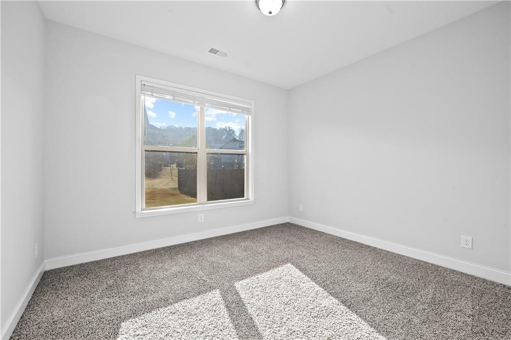 2770 Longacre Park Way Lawrenceville, GA 30044 - Photo 21 of 52 an empty room with a window