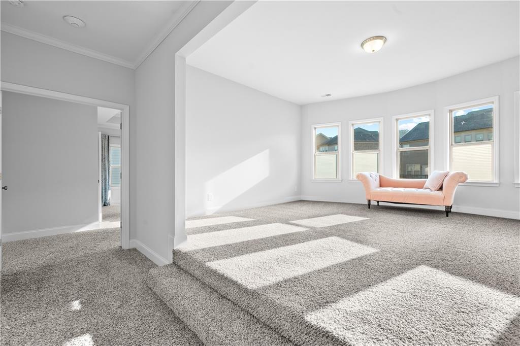 2770 Longacre Park Way Lawrenceville, GA 30044 - Photo 29 of 52 a living room with furniture and a large window