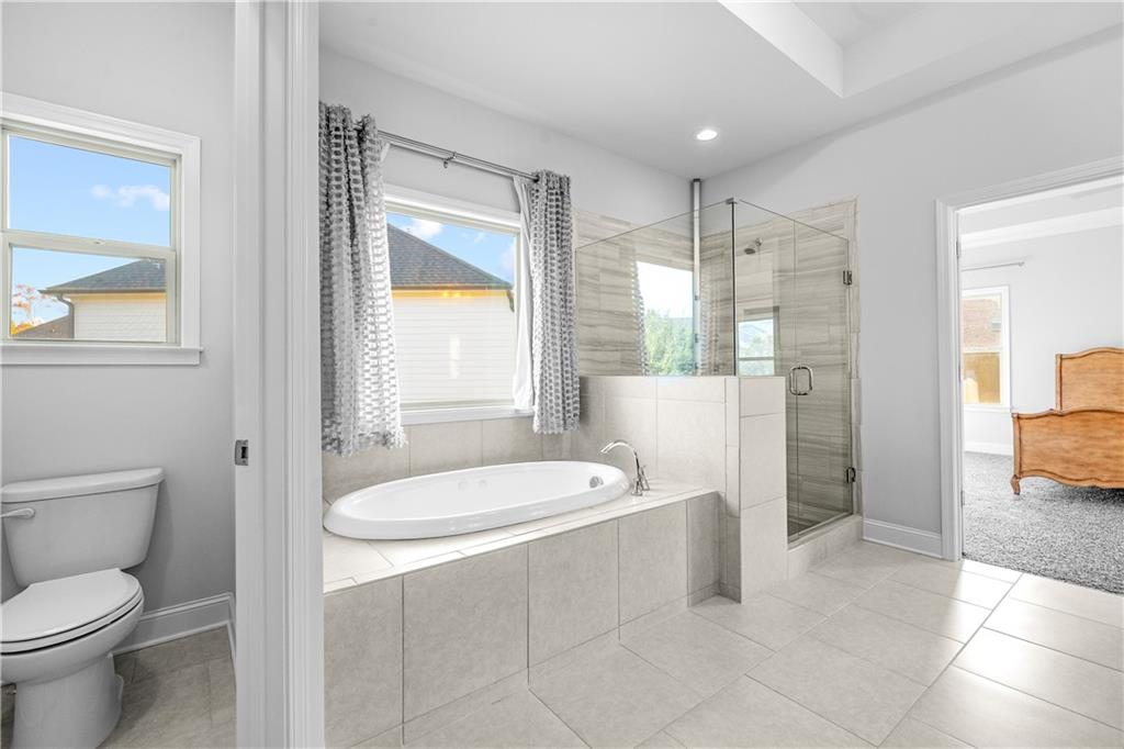 2770 Longacre Park Way Lawrenceville, GA 30044 - Photo 35 of 52 a bathroom with a sink toilet and shower