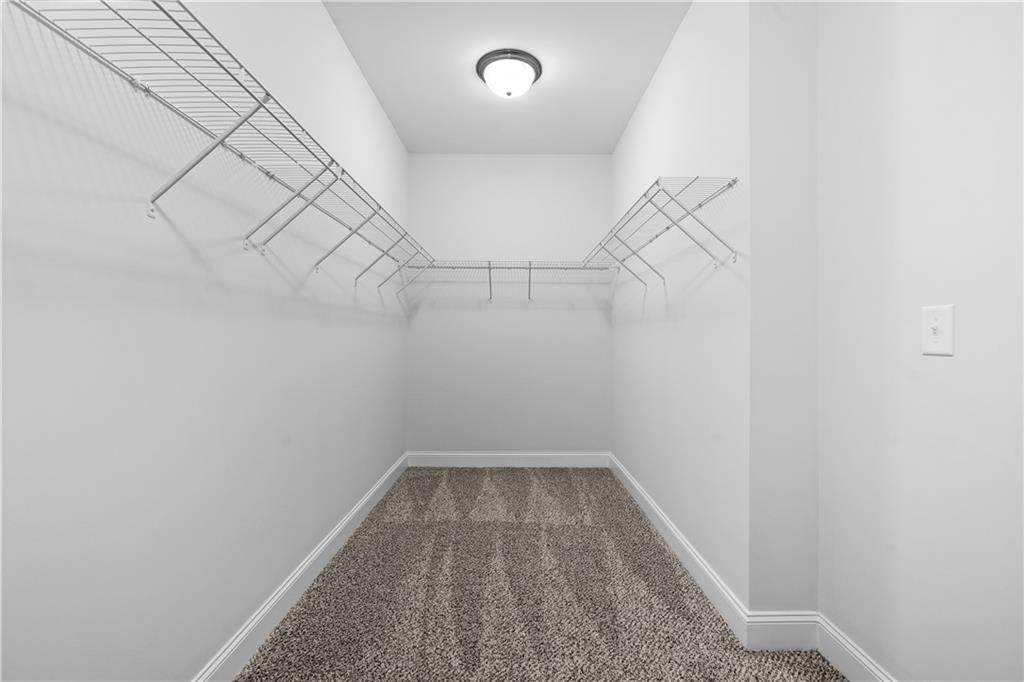 2770 Longacre Park Way Lawrenceville, GA 30044 - Photo 37 of 52 a view of a room with racks on the wall