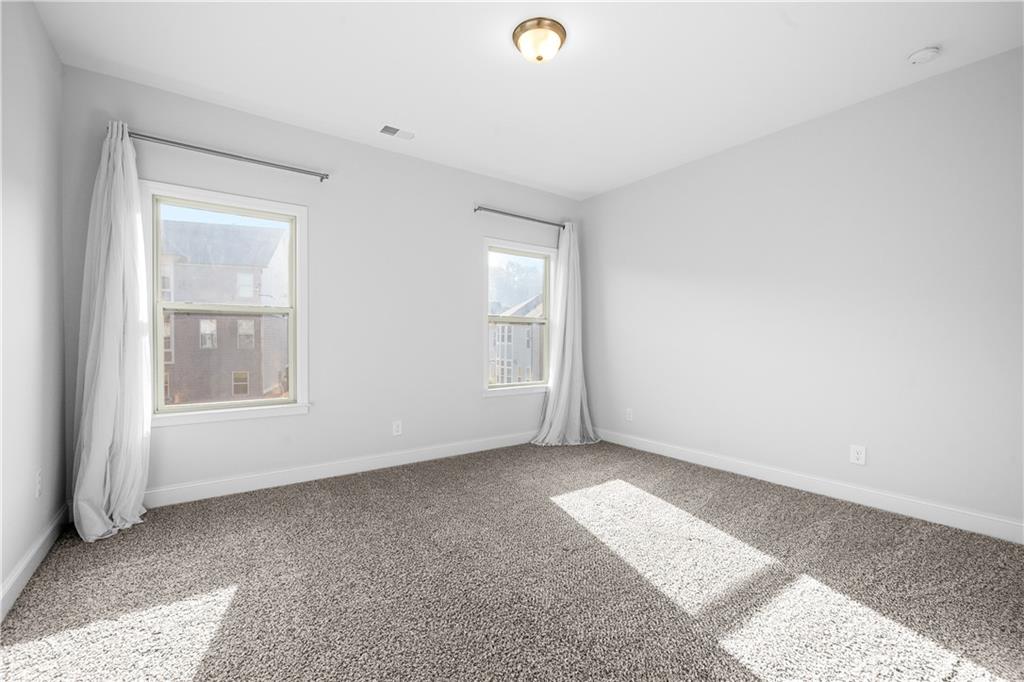 2770 Longacre Park Way Lawrenceville, GA 30044 - Photo 40 of 52 a view of an empty room with a window