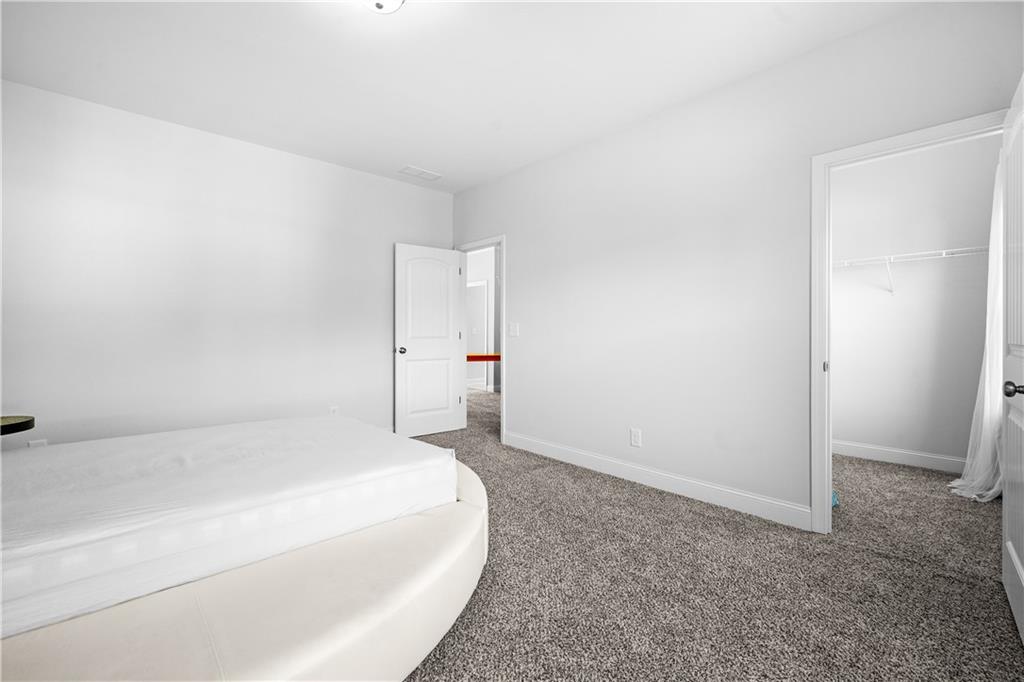 2770 Longacre Park Way Lawrenceville, GA 30044 - Photo 45 of 52 a large white bed in a white room