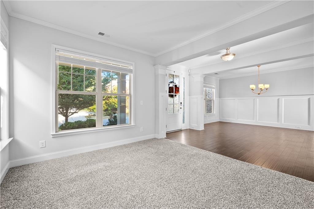 2770 Longacre Park Way Lawrenceville, GA 30044 - Photo 6 of 52 a view of a livingroom with wooden floor and windows